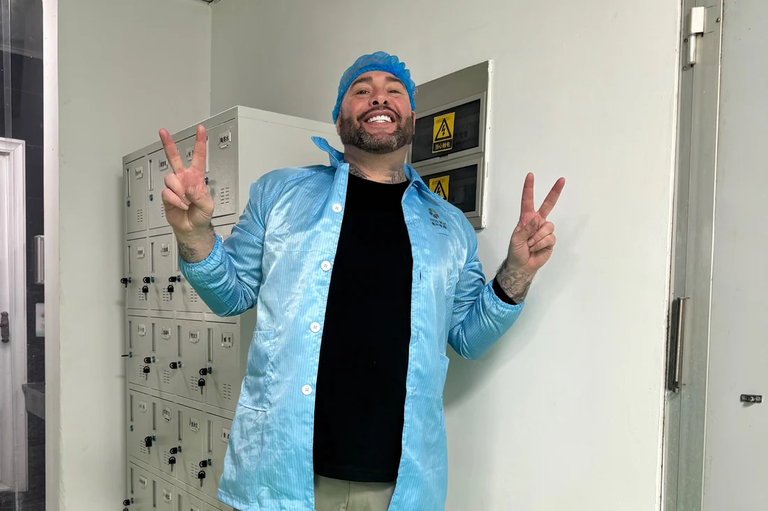 John Dawson Jr. gowned for the cleanroom at a partner factory in Shenzhen