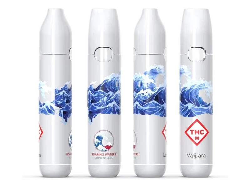 Four views of a Roaring Waters solventless disposable in white with a blue wave illustration and compliance marks