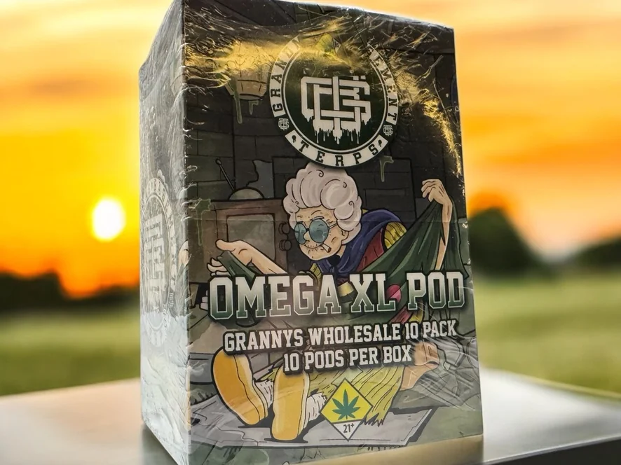 A shrink-wrapped Omega XL Pod wholesale ten-pack retail box with full-wrap illustrated artwork and compliance marks